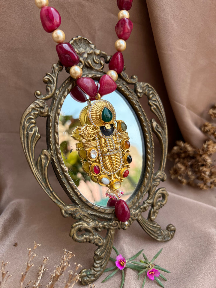 Navarathna studded Balaji pendant.