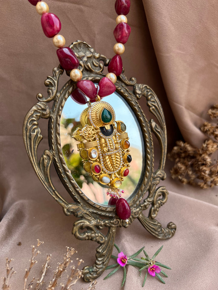 Navarathna studded Balaji pendant.